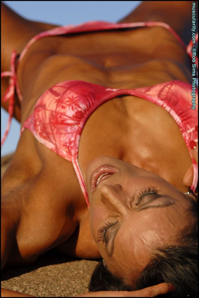 Deidre Pagnanelli lying down in a bikini.