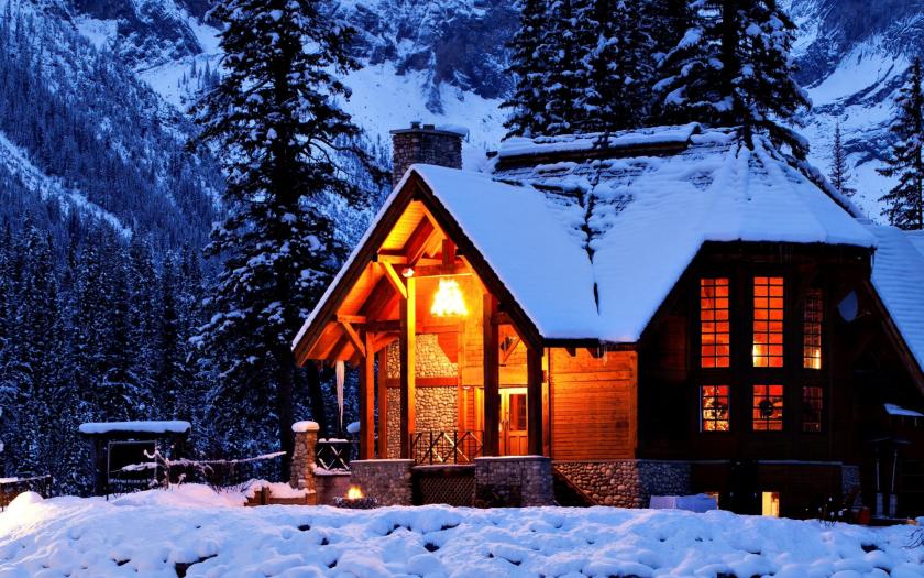 A picturesque log cabin in winter.