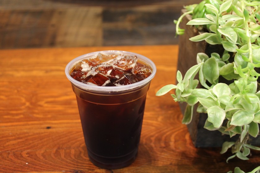 A cup of iced coffee.