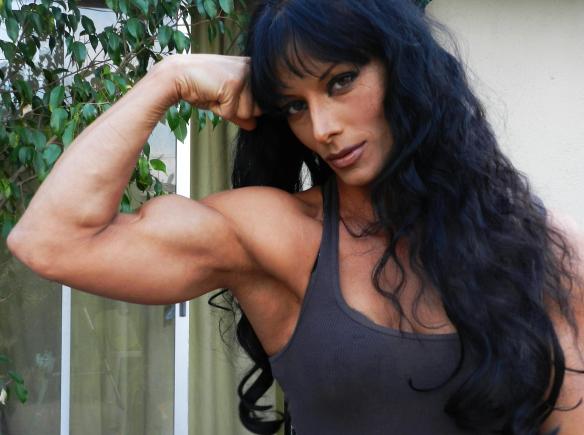 Deidre showing off her guns.